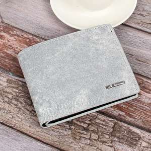 Close-up of a men's gray denim texture wallet with a rectangular metal brand logo