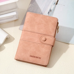 Close-up of pink RFID passport wallet featuring lychee texture and secure metal zipper