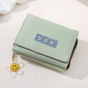 Short tri-fold light green wallet for women with daisy embroidery and flower charm