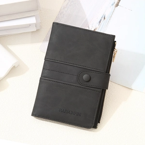Detail of RFID blocking passport wallet with buckle and zipper in matte black leather