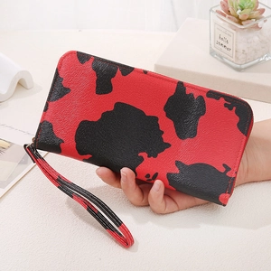 Women's long cow print clutch wallet with large capacity and wrist strap for smartphones