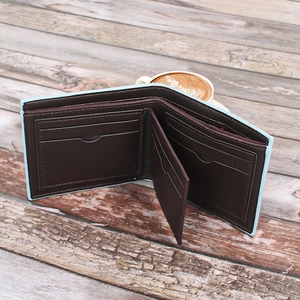Detailed interior view of bi-fold wallet featuring multi-card slots and denim blue edges