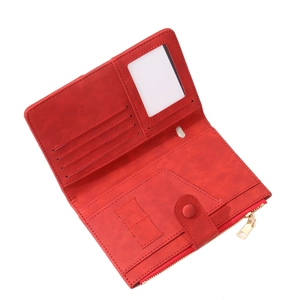 Detail view of red RFID travel passport wallet with multiple card slots and zipper pocket