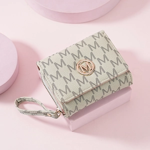 Close-up of beige letter print trifold wallet with round gold metal M logo detail
