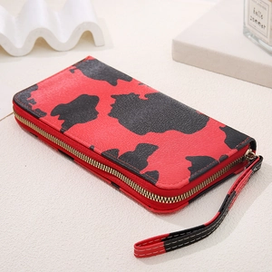 Macro shot of red cow pattern long wallet featuring high-quality lychee grain PU leather
