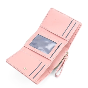 Pink tri-fold faux leather wallet featuring multiple card slots and a clear ID window