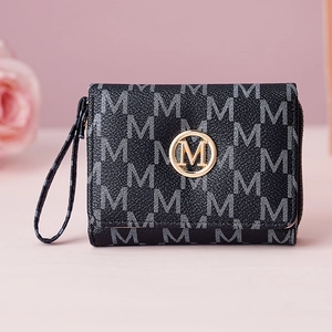 Detail view of the letter M print wallet with gold metal logo and textured leather finish