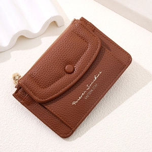 Brown litchi grain leather mini wallet with zipper closure and front snap pocket