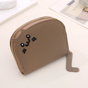 Detail of lychee pattern leather coin purse with cute cat embroidery and cat tail zipper pull