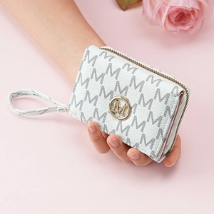 Detail of white leather mini wallet with gray M-pattern and gold logo on pink background