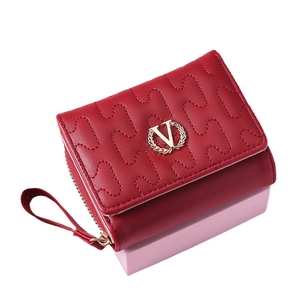 Red quilted leather tri-fold short wallet for women with golden V-logo and wristlet strap