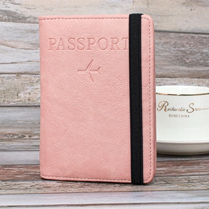 Pink RFID travel passport wallet in litchi grain faux leather with elastic band