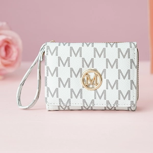 Detail of white leather wallet with M-letter print, gold logo, and wristlet strap
