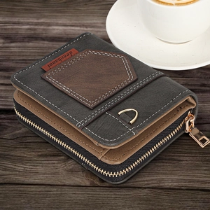 Detail of vintage bi-fold men's wallet with faux leather patchwork and bronze zipper