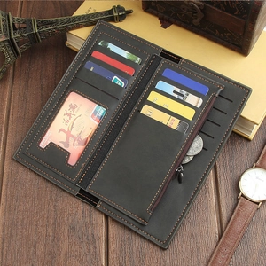 Detail of vintage long leather wallet for men featuring multiple card slots and clear ID window