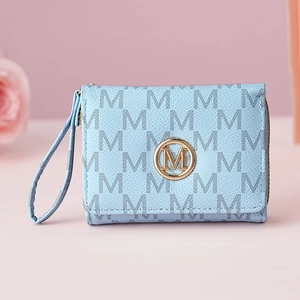 Macro detail of light blue letter print wallet with gold metal M logo and zipper