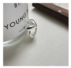 Detailed shot of S925 sterling silver adjustable heart ring with polished mirror finish