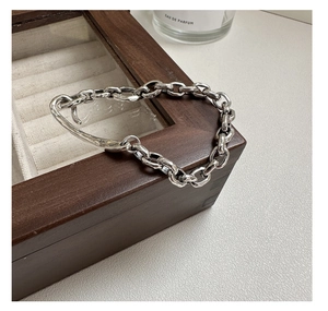 Detailed shot of S925 sterling silver stamp on vintage heavy chain link bracelet