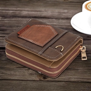 Close-up of vintage brown bi-fold wallet with zipper on a wooden table with coffee