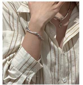 Close-up of vintage S925 silver liquid lava texture chain bracelet worn on a female wrist