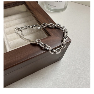 Detailed macro view of S925 sterling silver chain bracelet with vintage textured finish