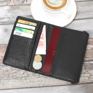 Detailed interior of a black leather travel passport wallet with card slots and cash pocket