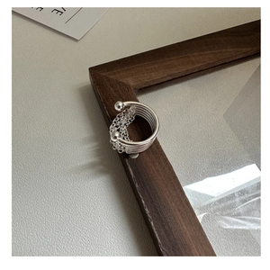 Close-up of S925 sterling silver multi-layer chain ring with tassels and beads detail