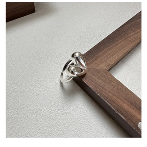 Macro shot of S925 sterling silver stamp on the inner band of heart shaped ring