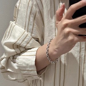 Vintage S925 sterling silver chunky link chain bracelet with textured clasp on wrist