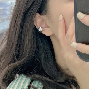 Minimalist S925 sterling silver triple layer ear cuff earring worn by a female model