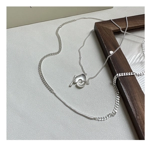Detail of S925 sterling silver necklace featuring OT toggle clasp and asymmetrical chain links