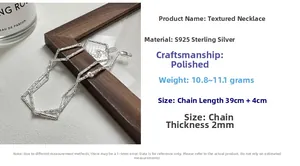 Detailed view of polished S925 sterling silver necklace with textured chain and wood frame