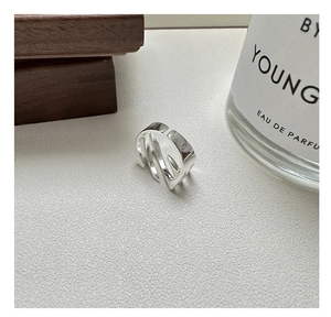 Detail view of the silver S925 sterling silver multilayer crisscross textured open ring