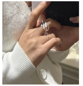 Detail of S925 sterling silver rings featuring a multi-layer geometric abstract design