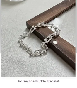 Macro shot of S925 sterling silver U-shaped horseshoe links with intricate industrial detail