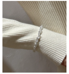 Close-up of S925 sterling silver U-shaped link bracelet with textured beaded finish