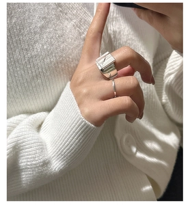 S925 sterling silver ring with unique wrinkled wavy texture on model's index finger