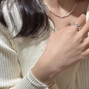 Minimalist S925 sterling silver jewelry set with textured wave necklace and bow ring