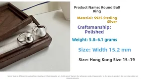 Detailed view of polished and brushed S925 sterling silver minimalist rings on wood box
