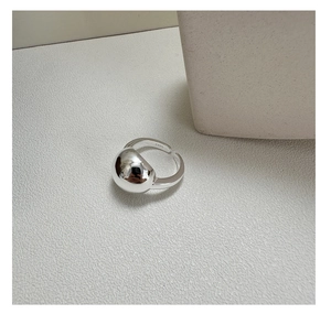 Macro detail of S925 sterling silver stamp on minimalist smooth ring with large sphere