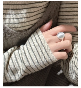 Close-up of S925 sterling silver ring featuring a frosted spherical texture on hand