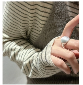 Close-up of matte brushed S925 sterling silver ring with textured heavy-duty finish
