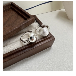 Detailed macro view of S925 sterling silver rings with polished and brushed textures