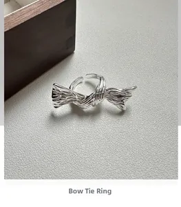 Macro detail of S925 sterling silver butterfly ring showing texture and metal hallmark