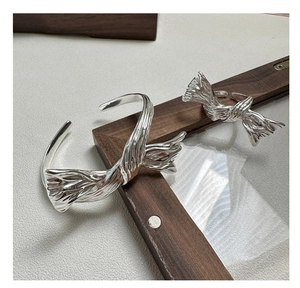 Detailed macro view of S925 sterling silver stamp on texture butterfly ring surface