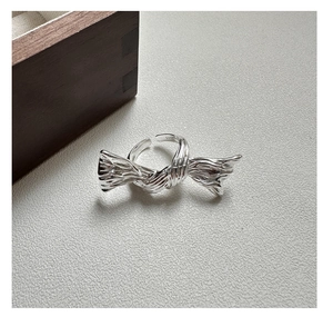 Detail showing the S925 sterling silver hallmark on adjustable butterfly knot ring