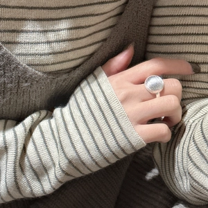 Minimalist S925 sterling silver ring with large round brushed texture disc on model finger