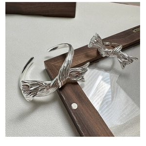 Detailed macro shot of S925 sterling silver ring showing liquid metal texture and stamp