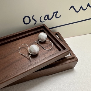 Elegant S925 sterling silver ball earrings with a brushed matte texture and hook style