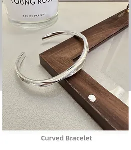 Close-up of S925 sterling silver cuff bracelet with unique irregular pleated texture